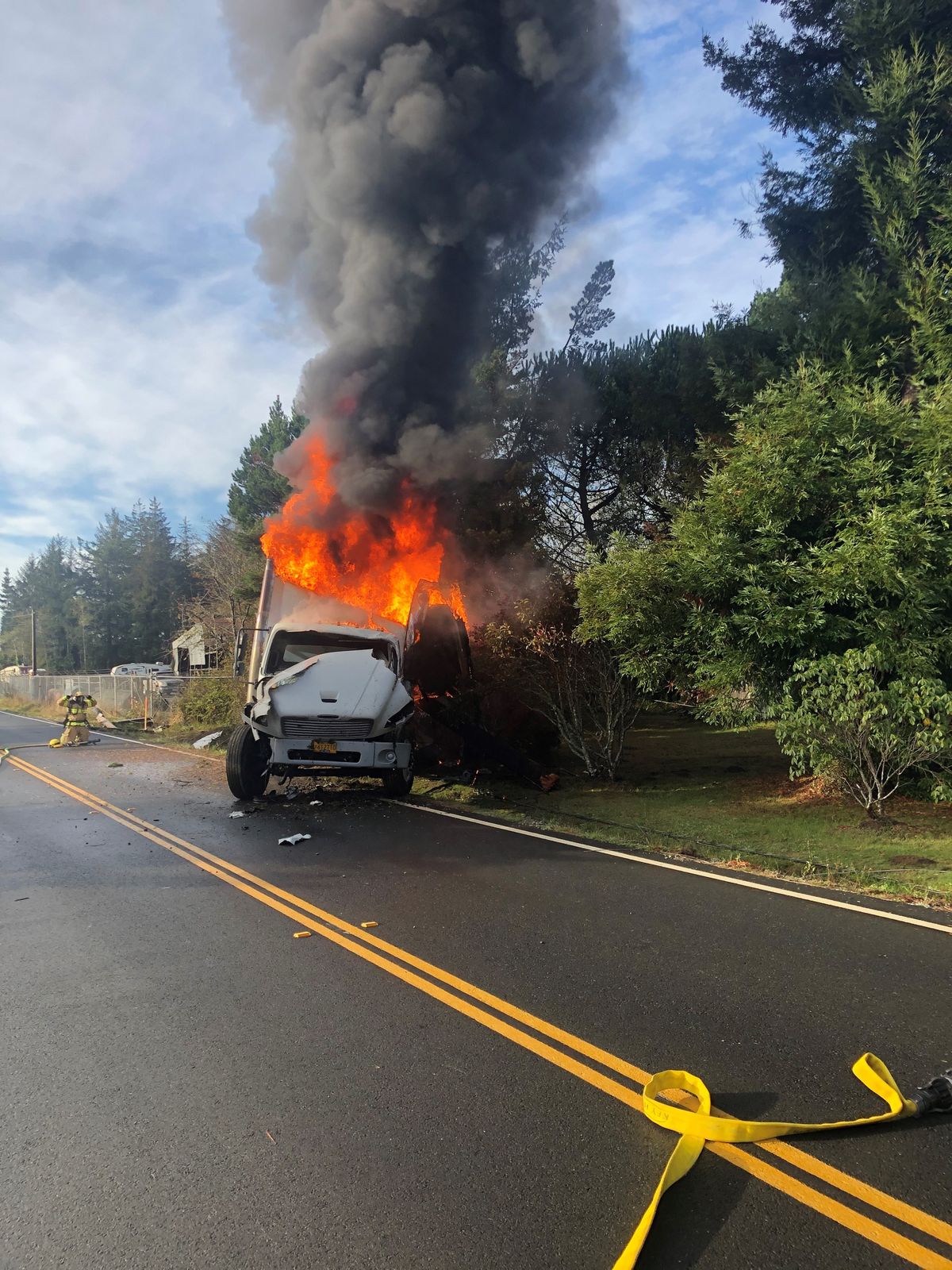 No one seriously injured when truck hits pole, burns