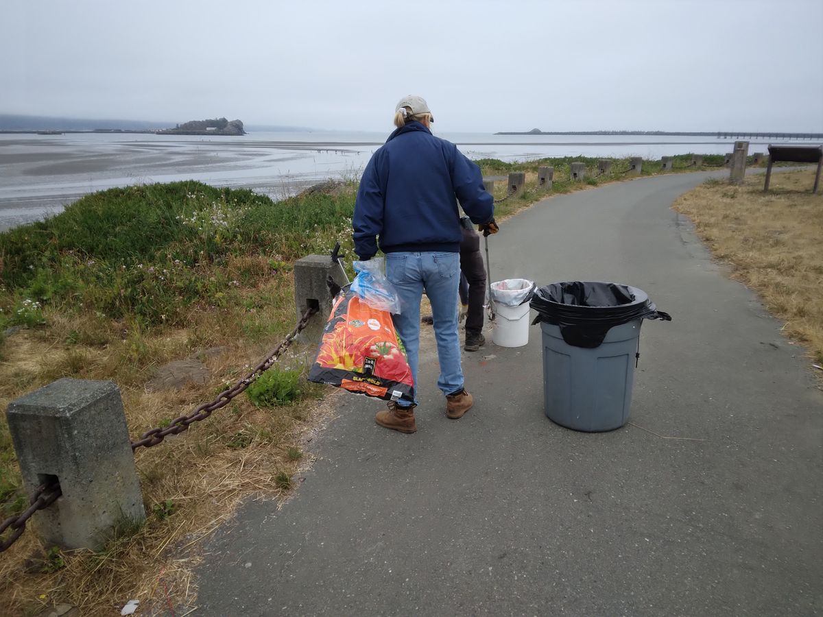 Volunteers clean up after the party