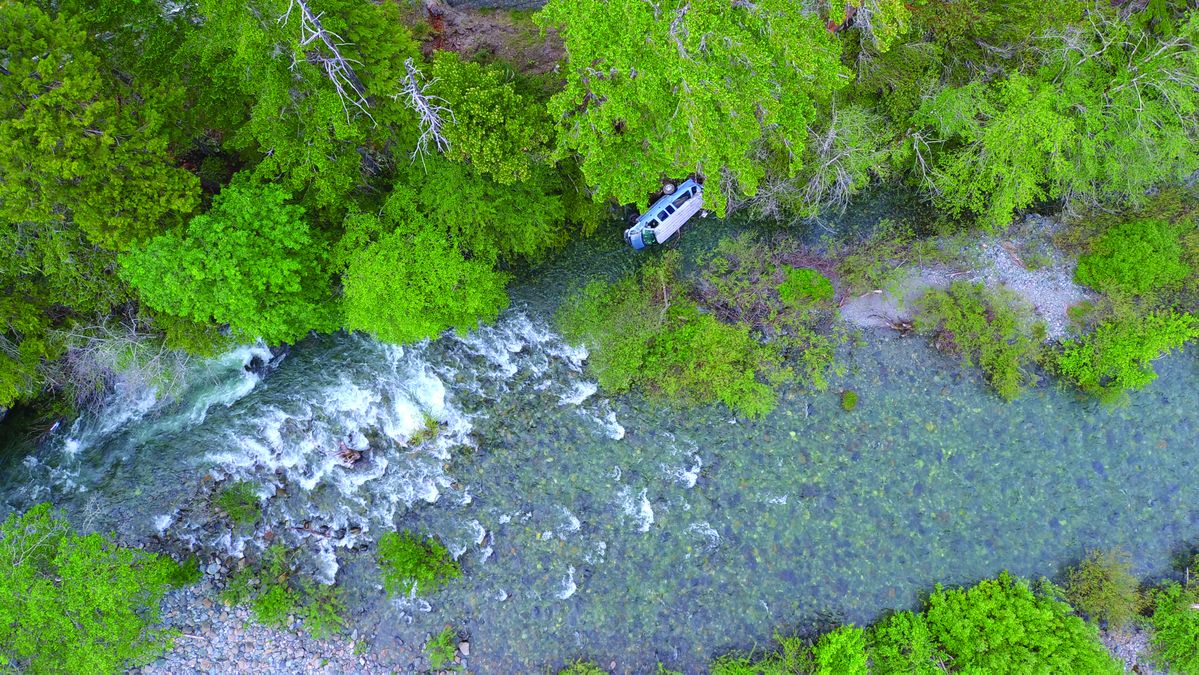Minivan plunges 80 feet into river