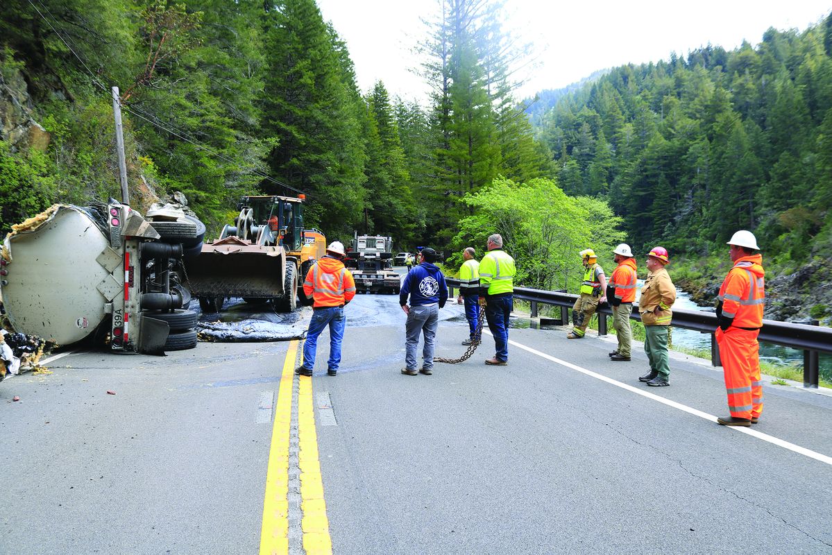 Asphalt tanker spills load on highway
