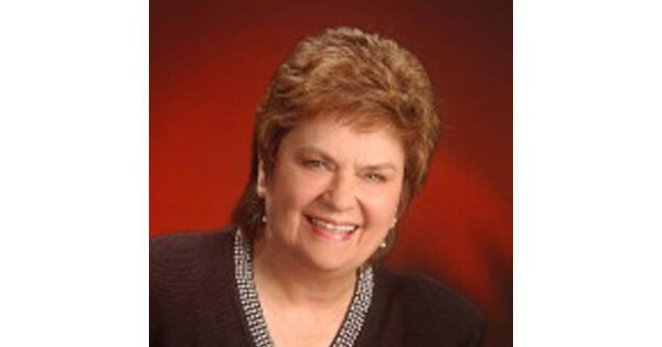 Local Realtor leaves her footprints in the sand