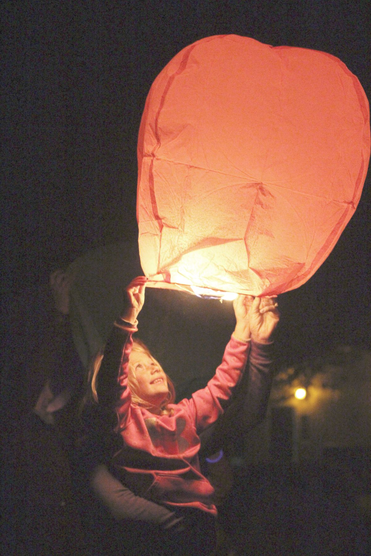 Families illuminate the sky in remembrance of their lost children