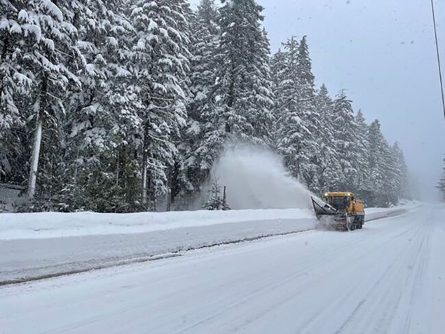 Prepare for snowy travel on mountain passes, high-elevation areas